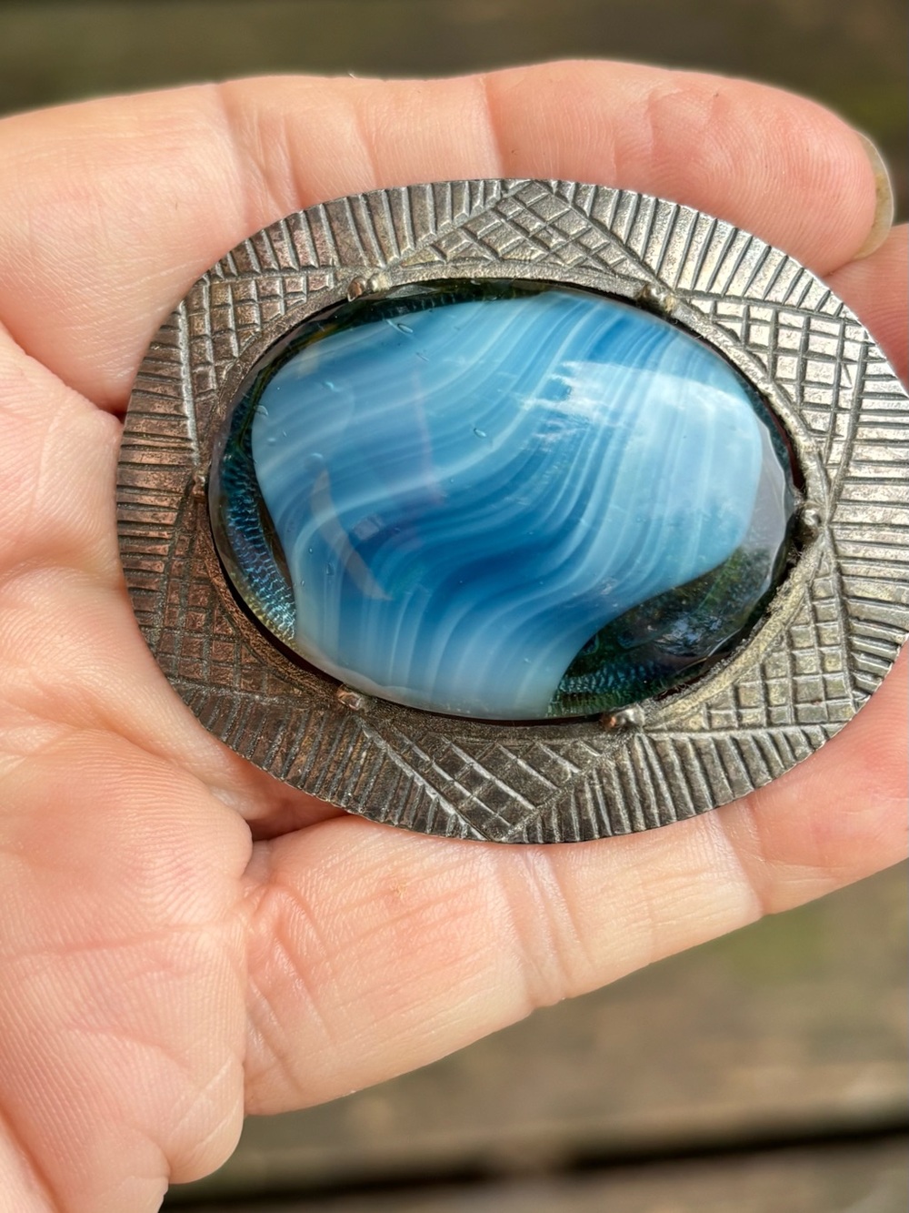 Corocraft brooch with blue swirl glass